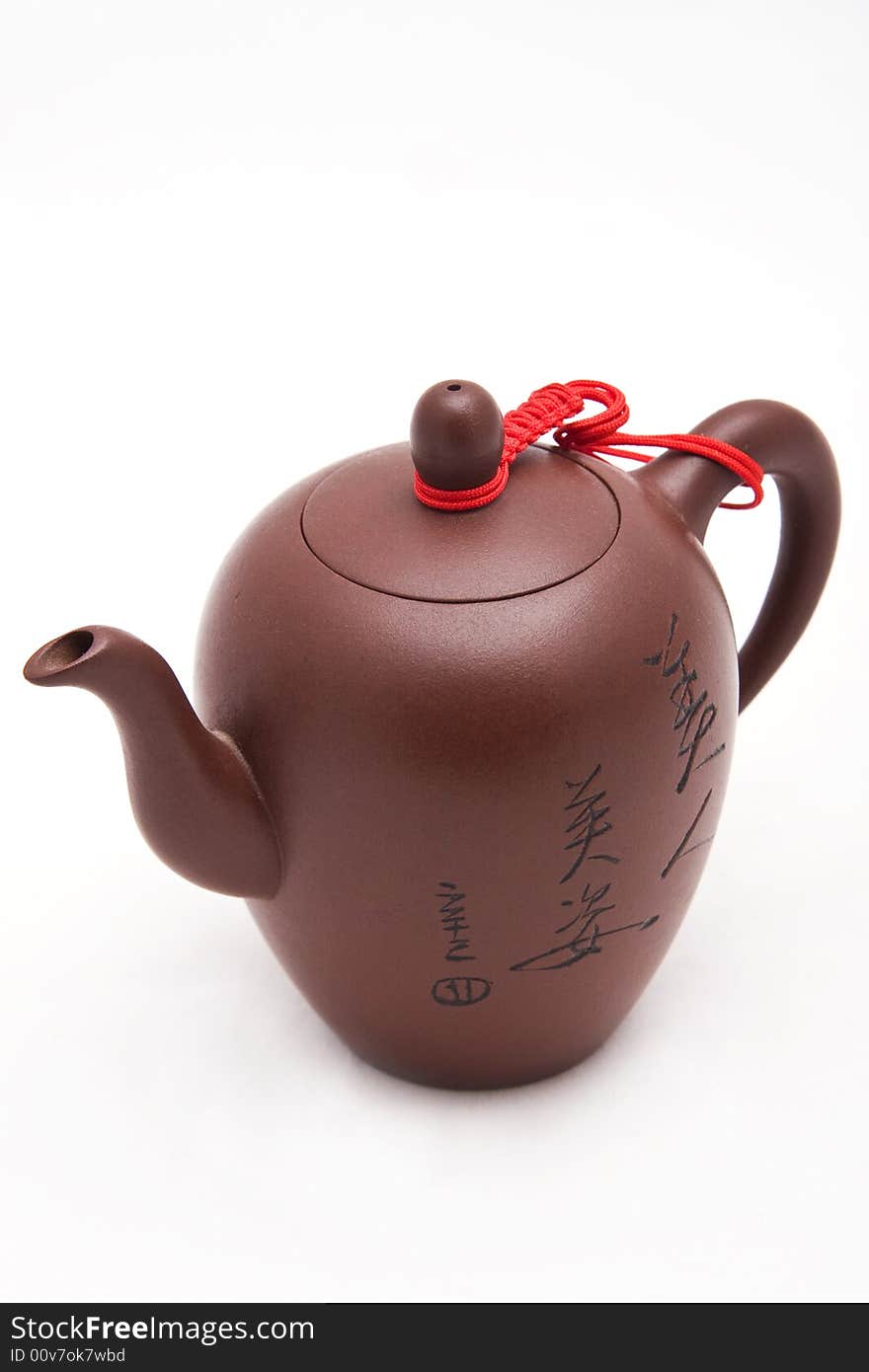 Brown solemnity teapot with hieroglyphs without a background