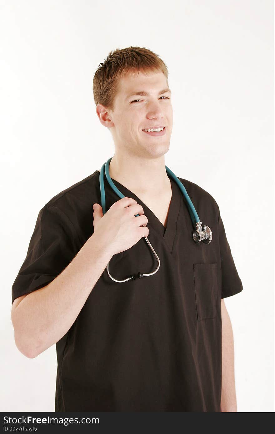 Young male doctor wearing scrubs and stethoscope. Young male doctor wearing scrubs and stethoscope