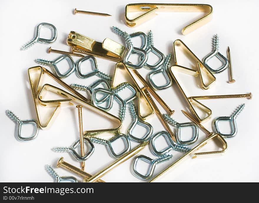 Closeup of nails and hardware used for framing artwork or pictures. Closeup of nails and hardware used for framing artwork or pictures