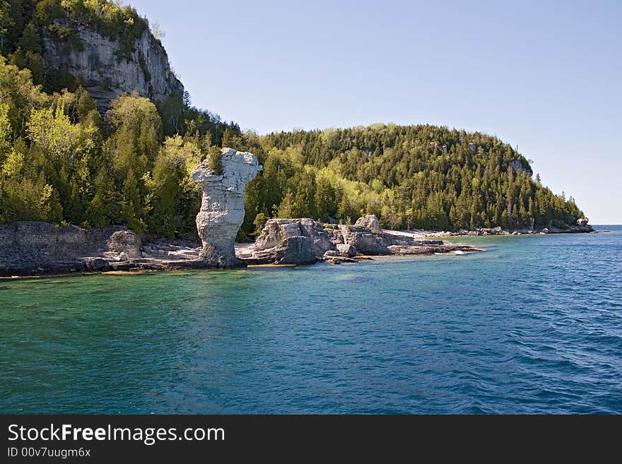 Tobermory view from boat to rocky beach. Tobermory view from boat to rocky beach