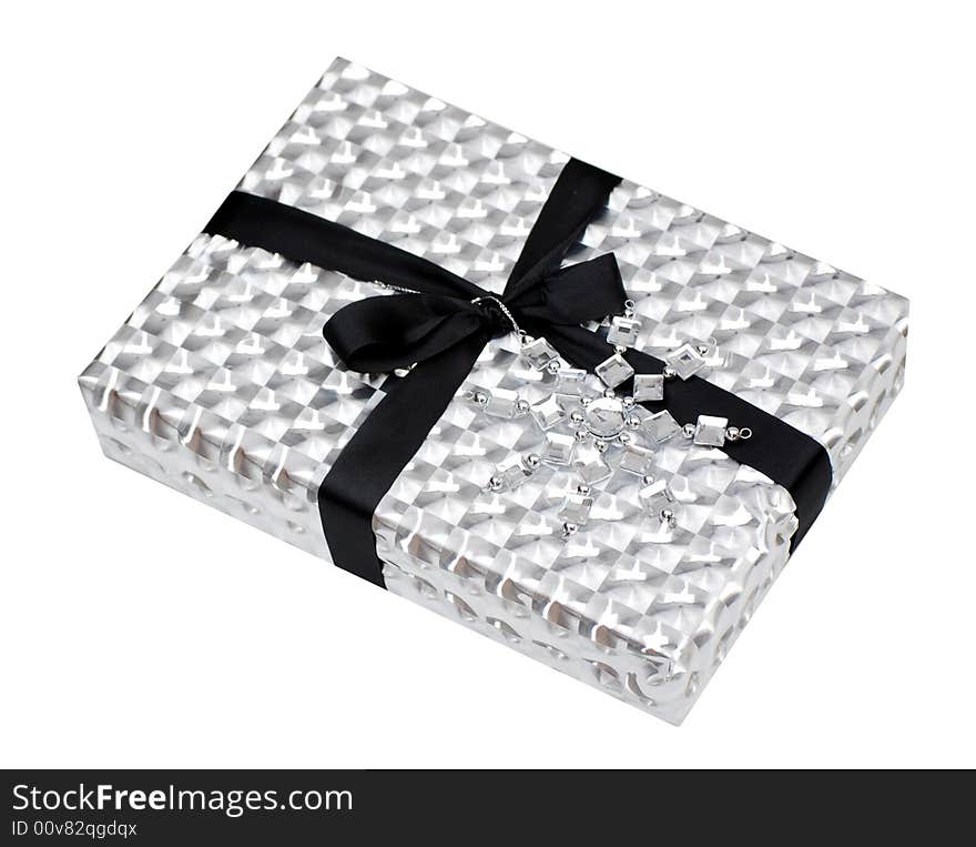 Gift box wrapped in metallic paper on white. Gift box wrapped in metallic paper on white