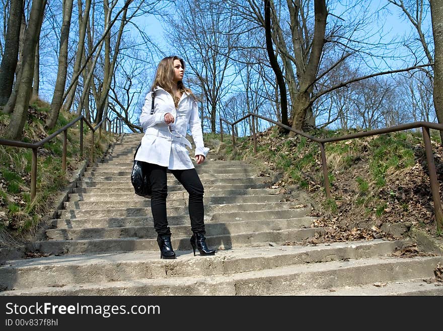 Girl in a white raincoat