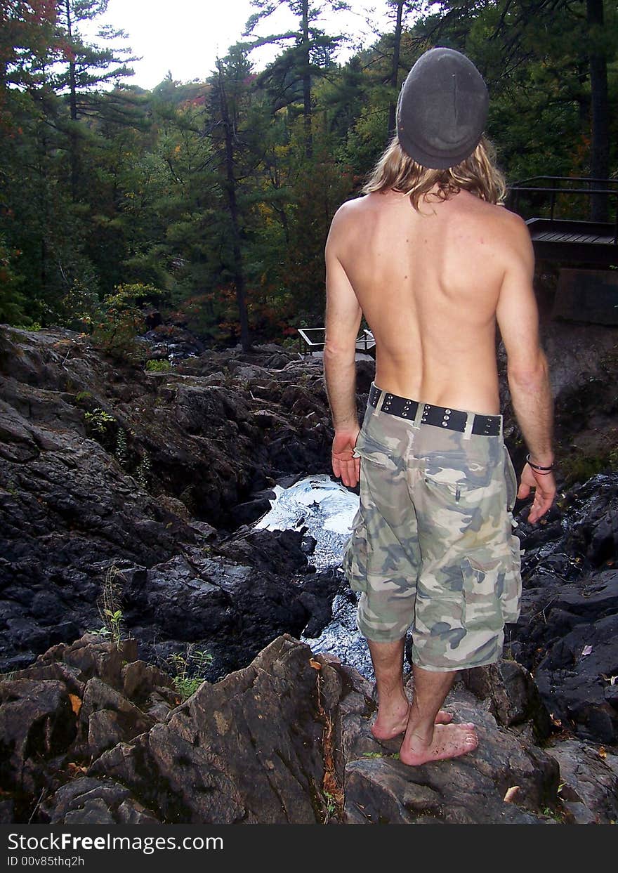 A man hiking through the woods in Canada. A man hiking through the woods in Canada.