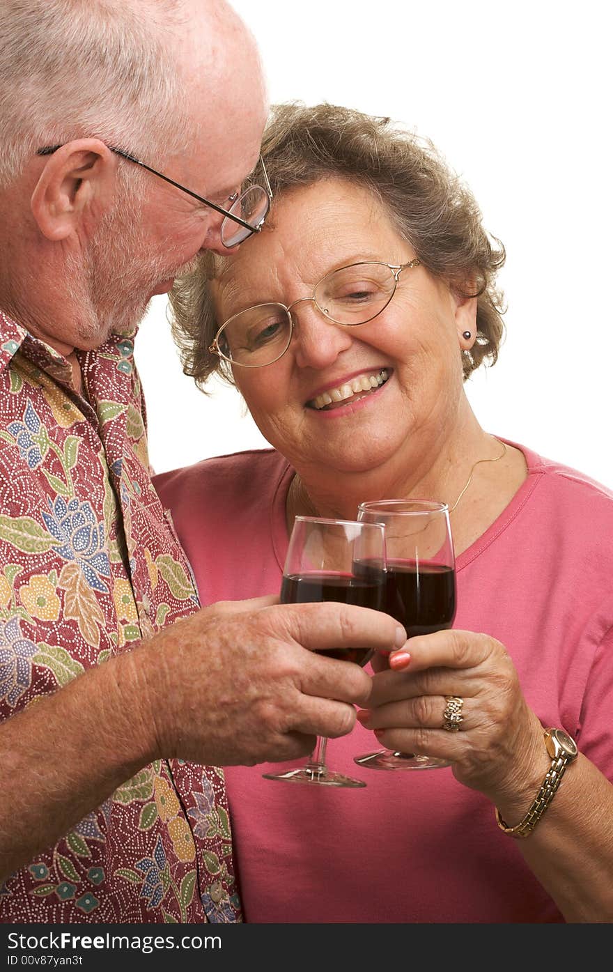 Happy Senior Couple toasting with Wine glasses.