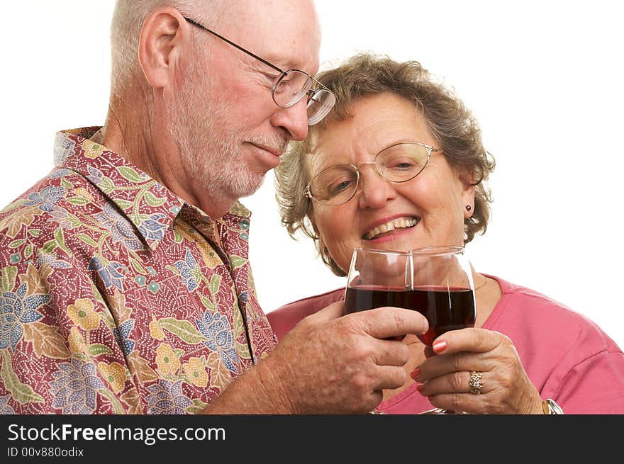 Happy Senior Couple toasting with Wine glasses.