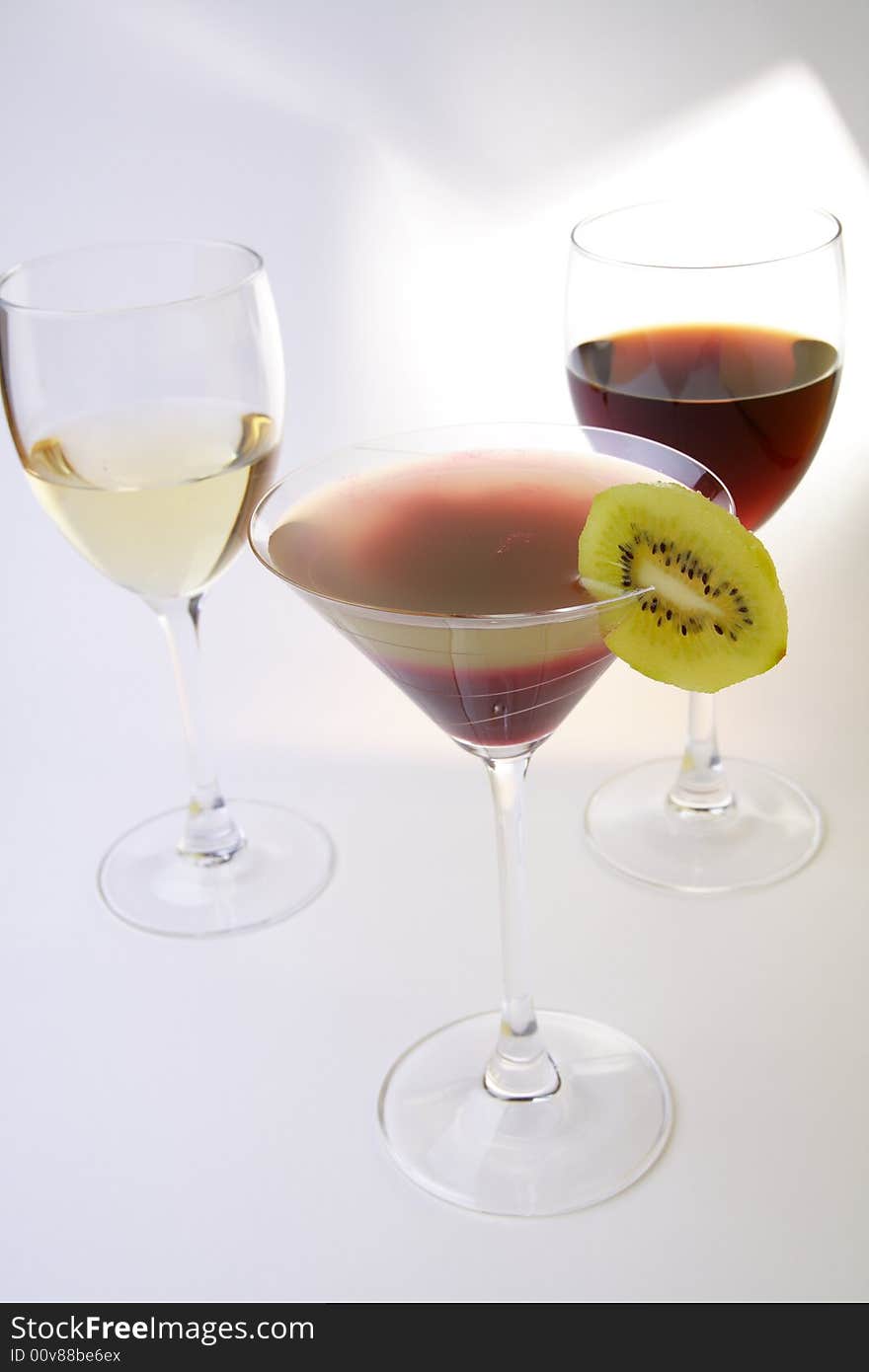 Glasses with white and red wine and layered cocktail. Glasses with white and red wine and layered cocktail