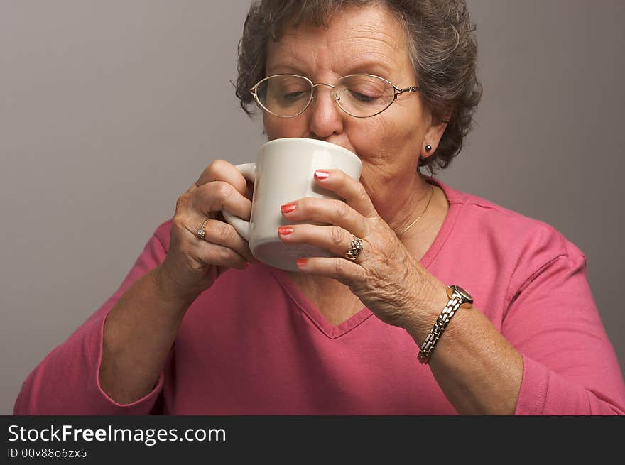 Grandma Enjoys a Cup of Hot Coffee. Grandma Enjoys a Cup of Hot Coffee
