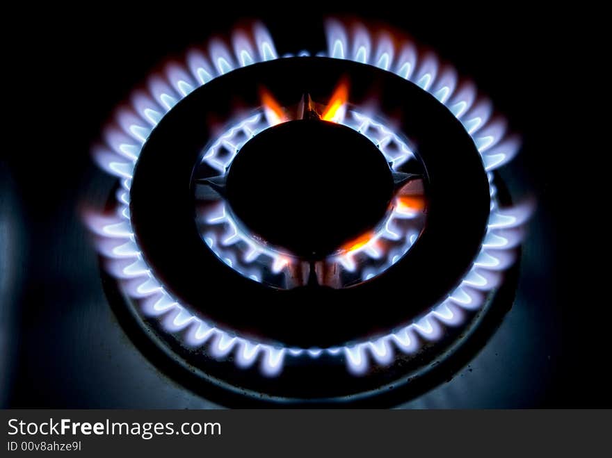 Flames of gas stove in the dark