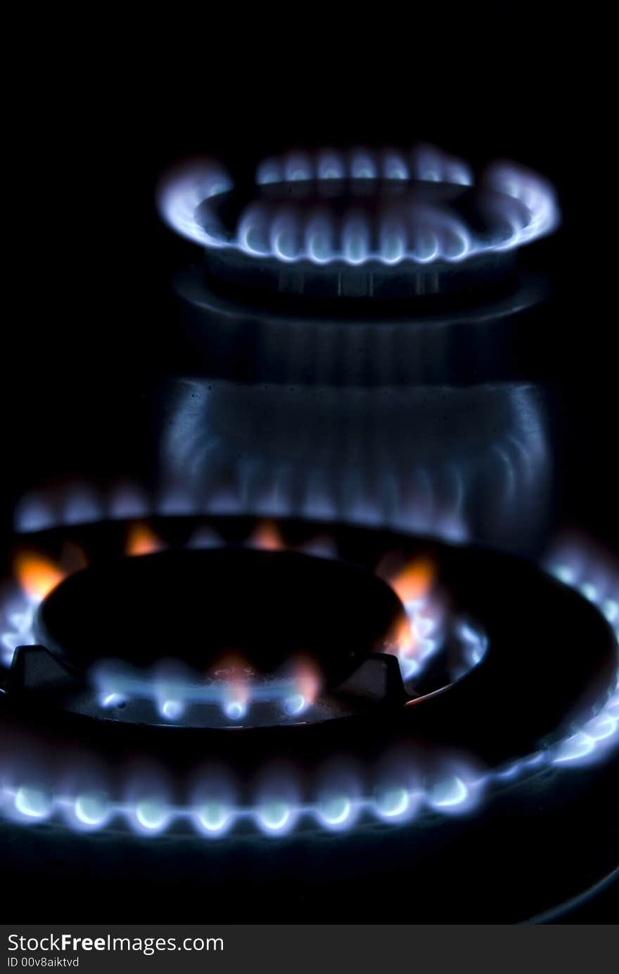 Flames of gas stove in the dark