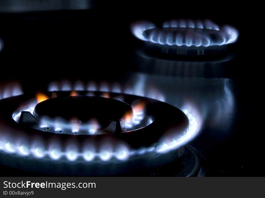 Flames of gas stove in the dark