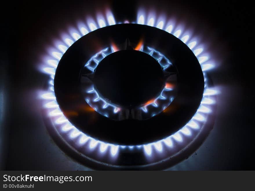 Flames of gas stove in the dark