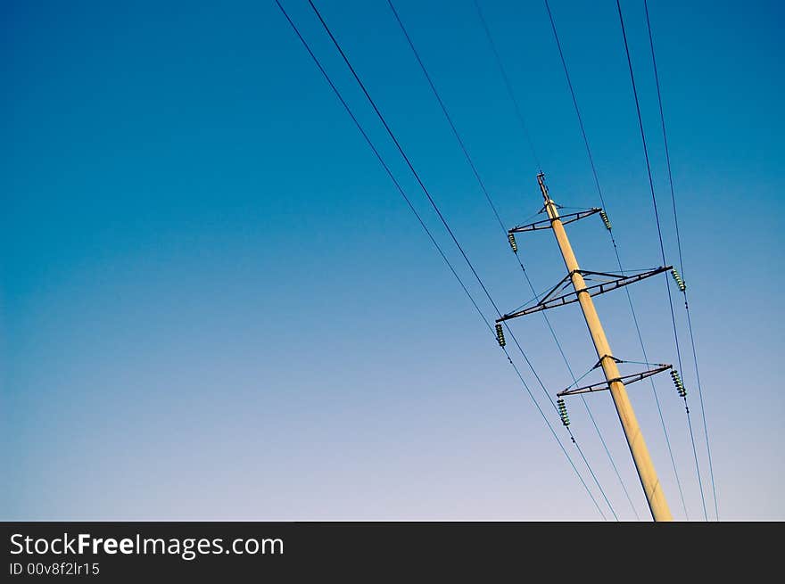 High voltage electricity pylon and blue sky. High voltage electricity pylon and blue sky