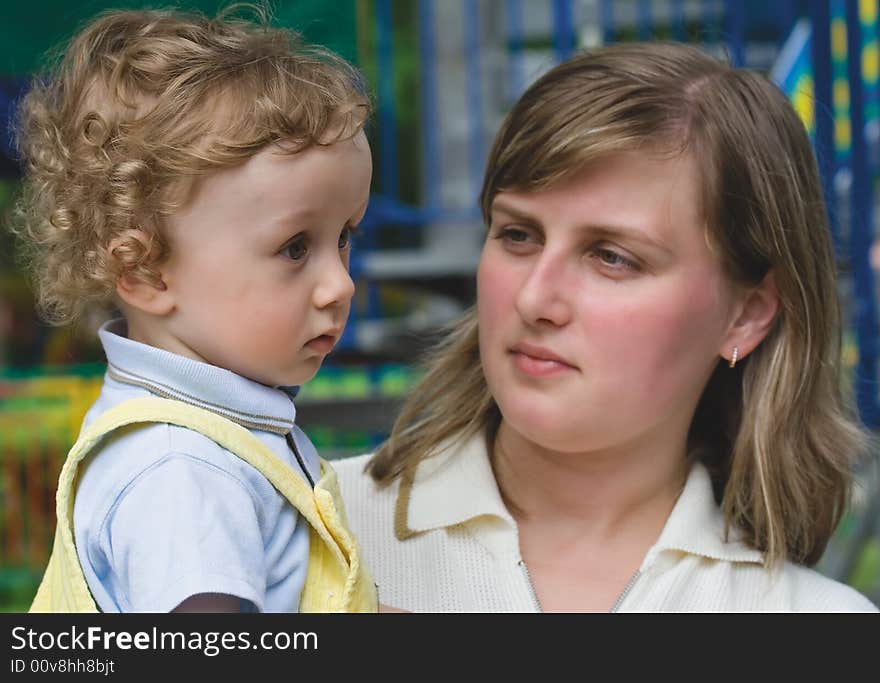 Young Woman With The Small Curly Boy On Hands (1)