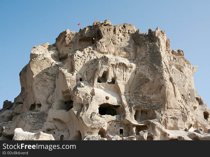 Rock fortress carved out of mountain in cappadocia