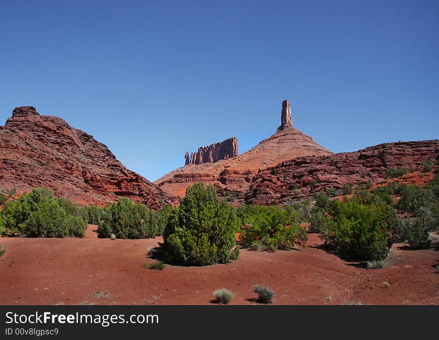 View of the red rock formations in Canyonlands National Park with blue skies. View of the red rock formations in Canyonlands National Park with blue skies