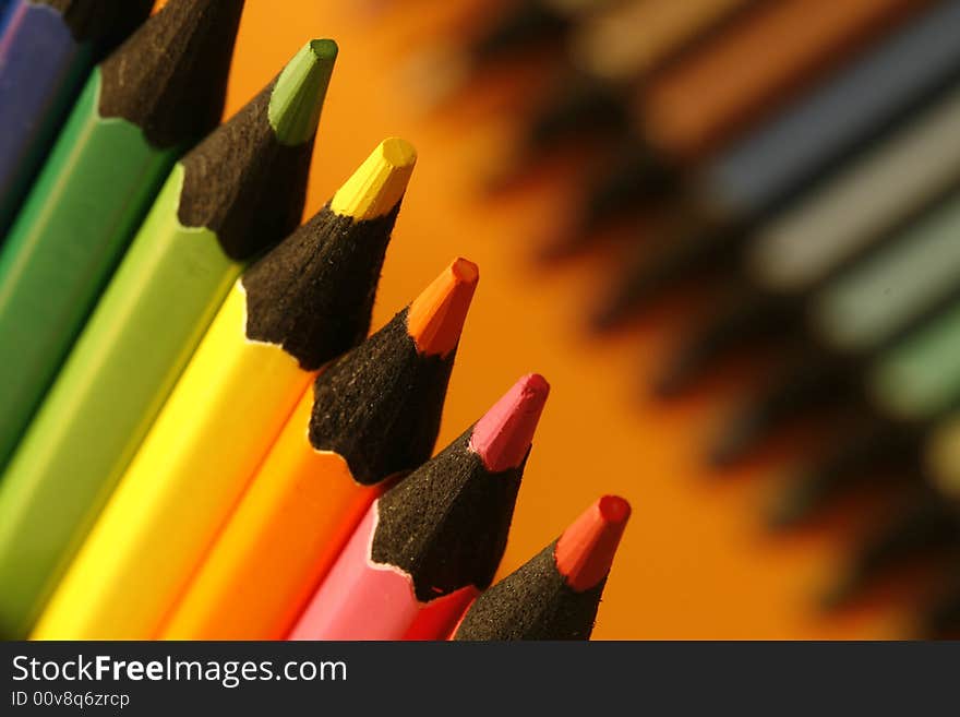 A part of pencils with a simple colorful background. A part of pencils with a simple colorful background