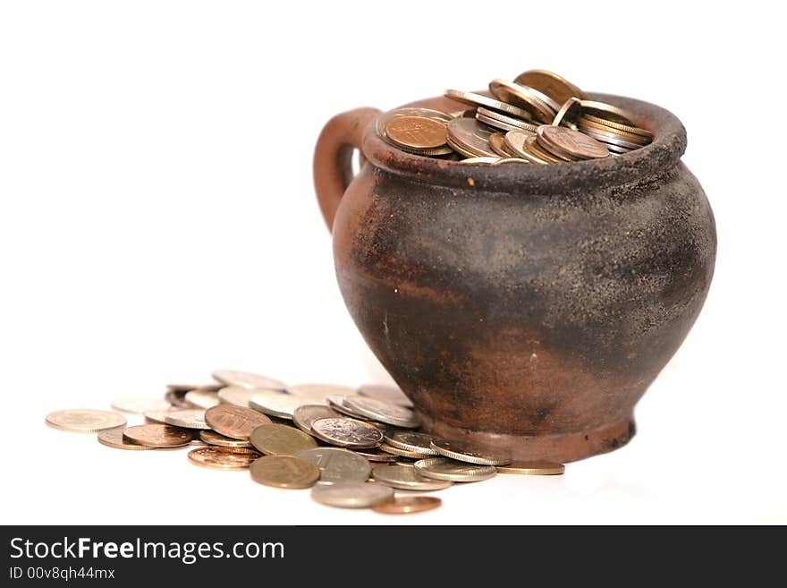 Coins in the clay jar. Coins in the clay jar