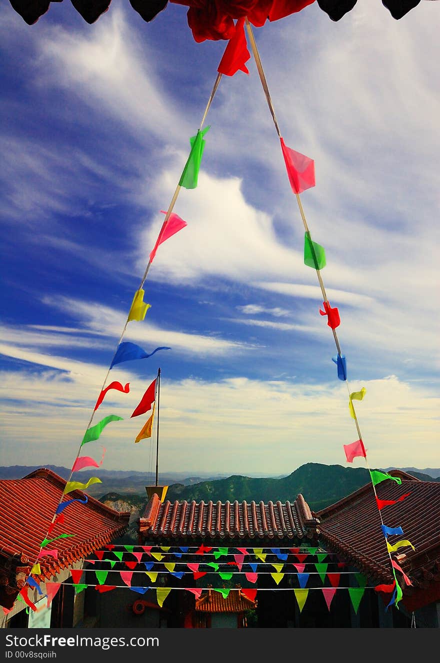 This is a temple in the Weihai Shandong China, located at a summit, in the holiday is fluttering the colored flag. This is a temple in the Weihai Shandong China, located at a summit, in the holiday is fluttering the colored flag