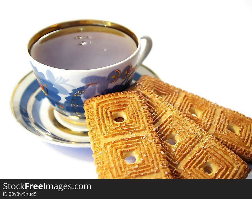 Cup of tea and cookies isolated