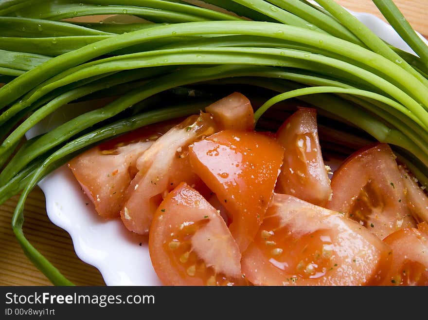 Green onion and tomato ready for lunch. Green onion and tomato ready for lunch