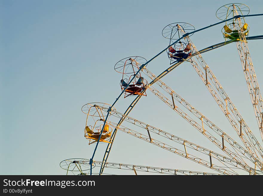 Carousel round on blue sky. Carousel round on blue sky