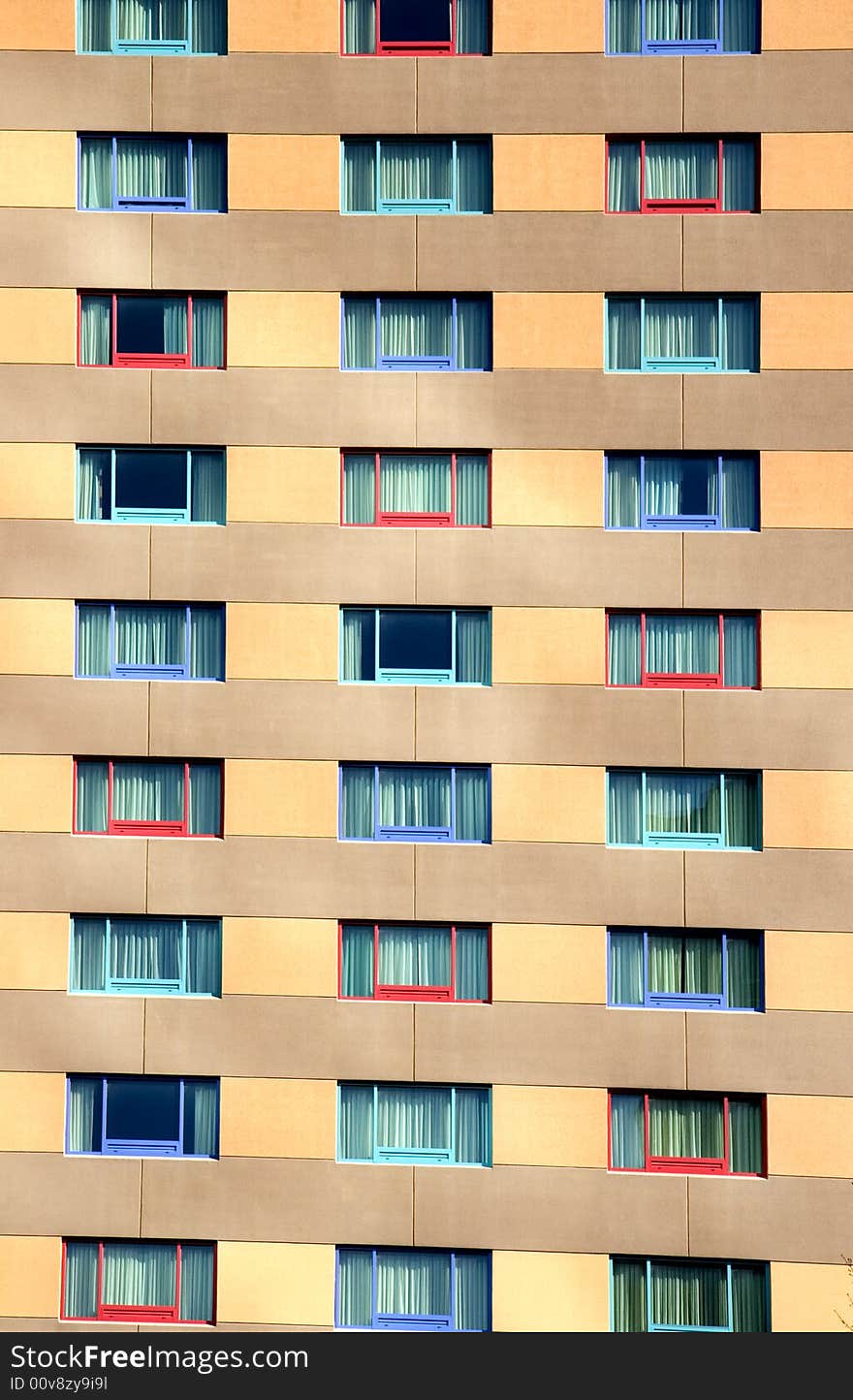 The wall and colorful windows of an modern urban hotel. The wall and colorful windows of an modern urban hotel