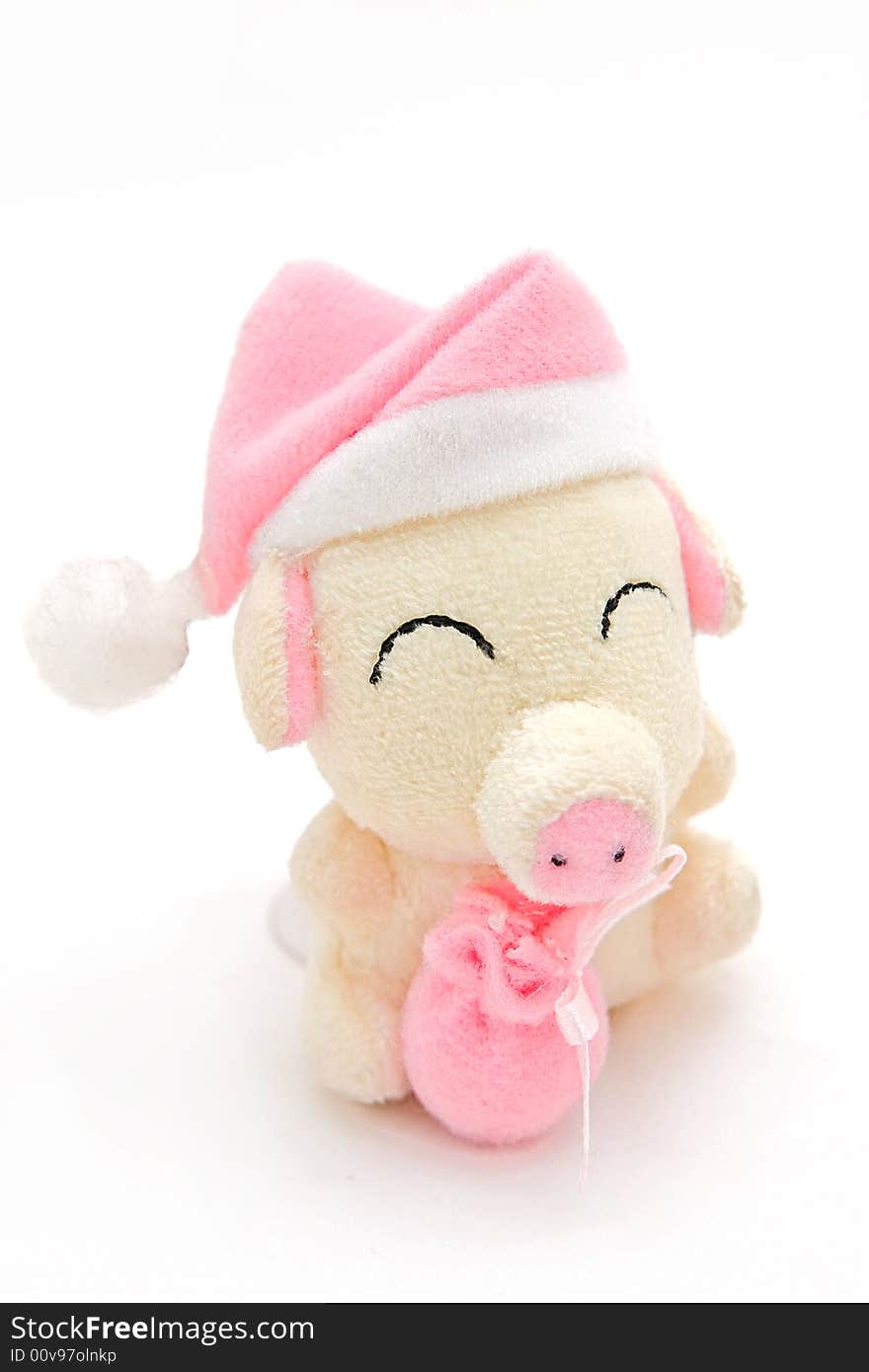 Small pink soft toy a pig with pink packet in hands. Small pink soft toy a pig with pink packet in hands