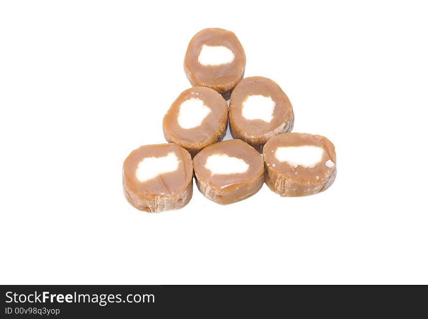 Brown carmel candy pyramid with white centers. Brown carmel candy pyramid with white centers