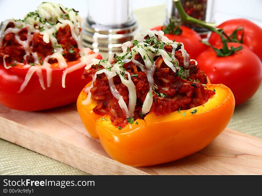 Peppers stuffed with beef, rice, tomato mixture and topped with mozzarella. Peppers stuffed with beef, rice, tomato mixture and topped with mozzarella