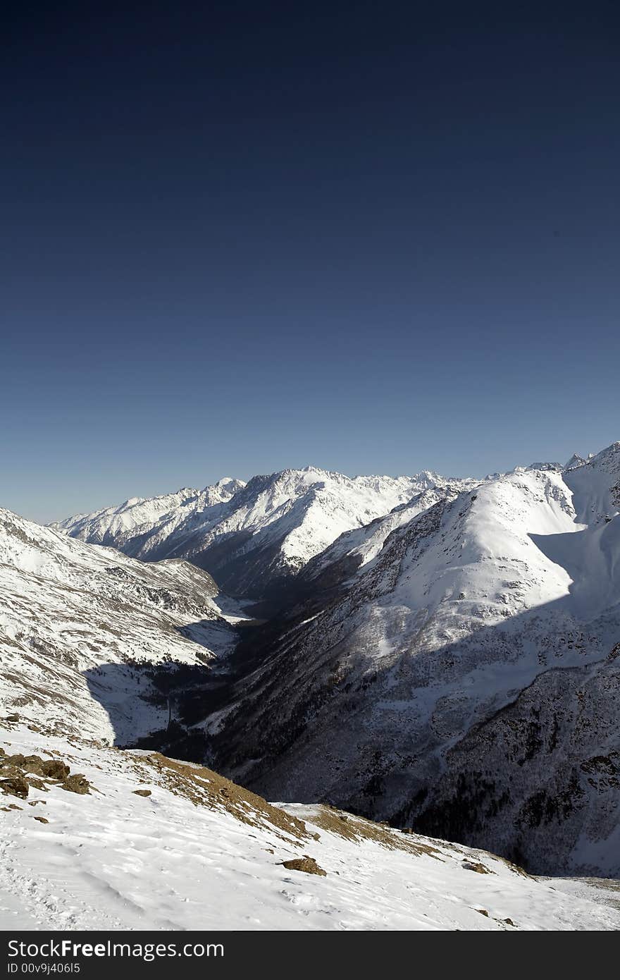 Winter mountain peaks and a lot of snow. Winter mountain peaks and a lot of snow