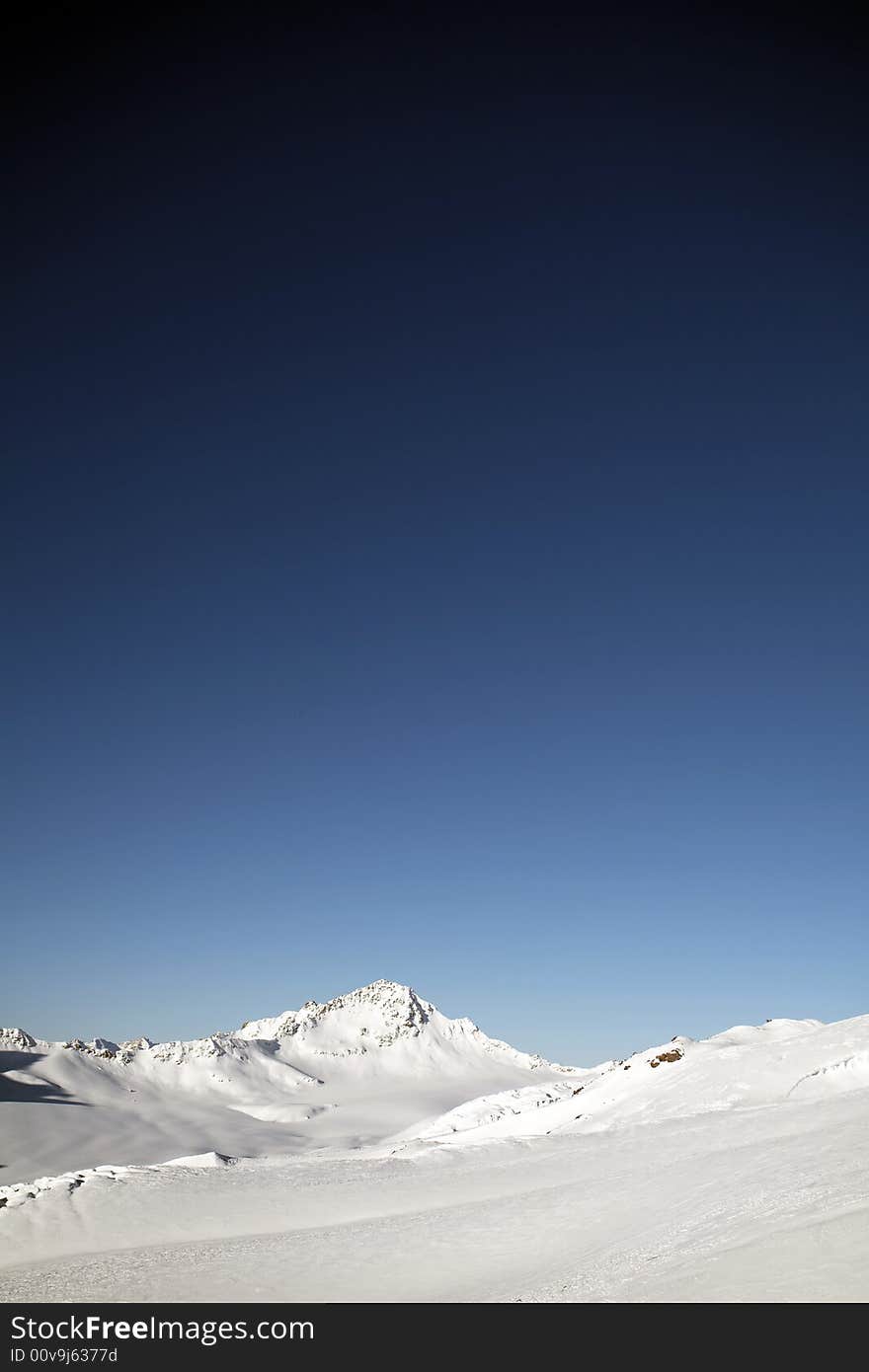 Winter mountain peaks and a lot of snow. Winter mountain peaks and a lot of snow