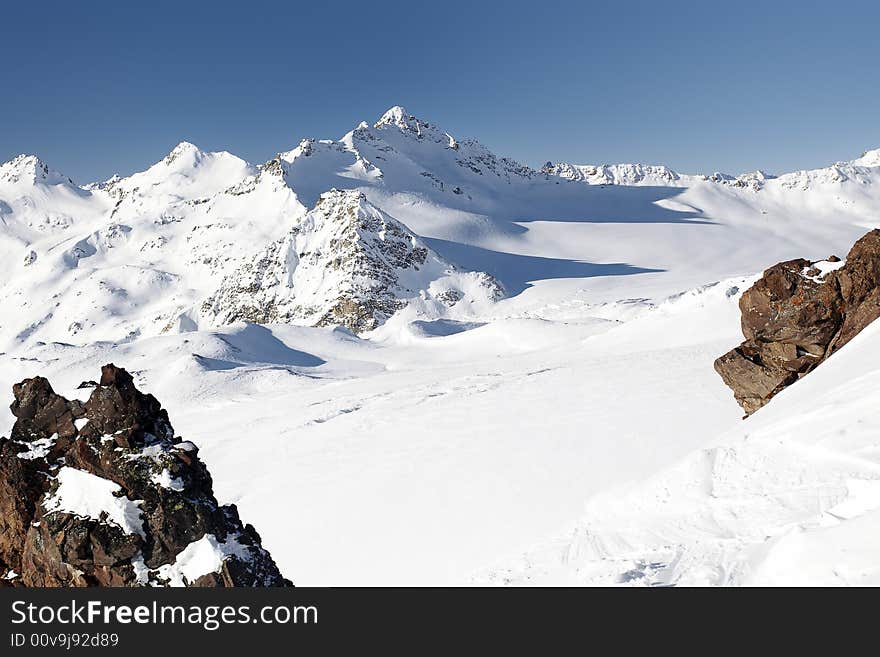 Winter mountain peaks and a lot of snow. Winter mountain peaks and a lot of snow