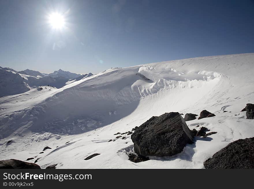 Winter mountain peaks and a lot of snow. Winter mountain peaks and a lot of snow