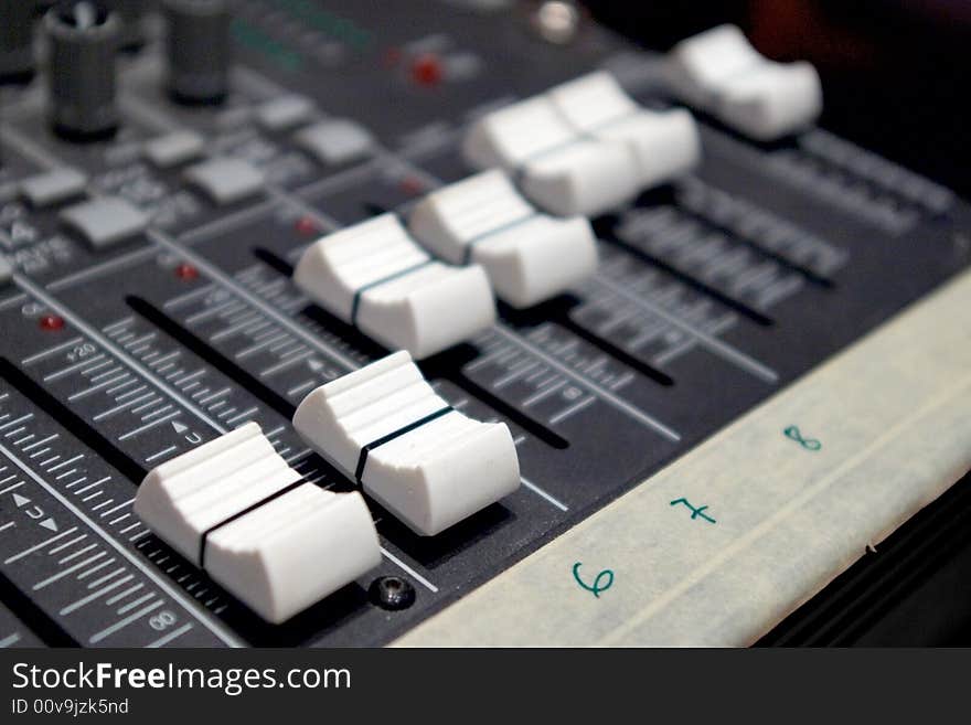 Faders of sound mixer closeup