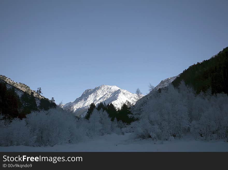 Winter mountain peaks and a lot of snow. Winter mountain peaks and a lot of snow