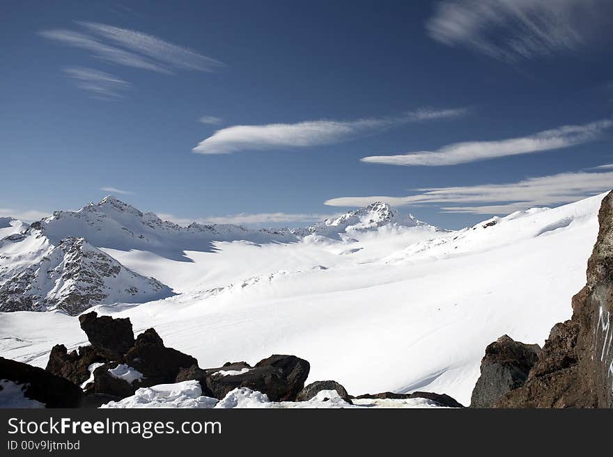 Winter mountain peaks and a lot of snow. Winter mountain peaks and a lot of snow