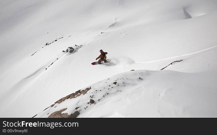 Snowboard freeride in high mountains