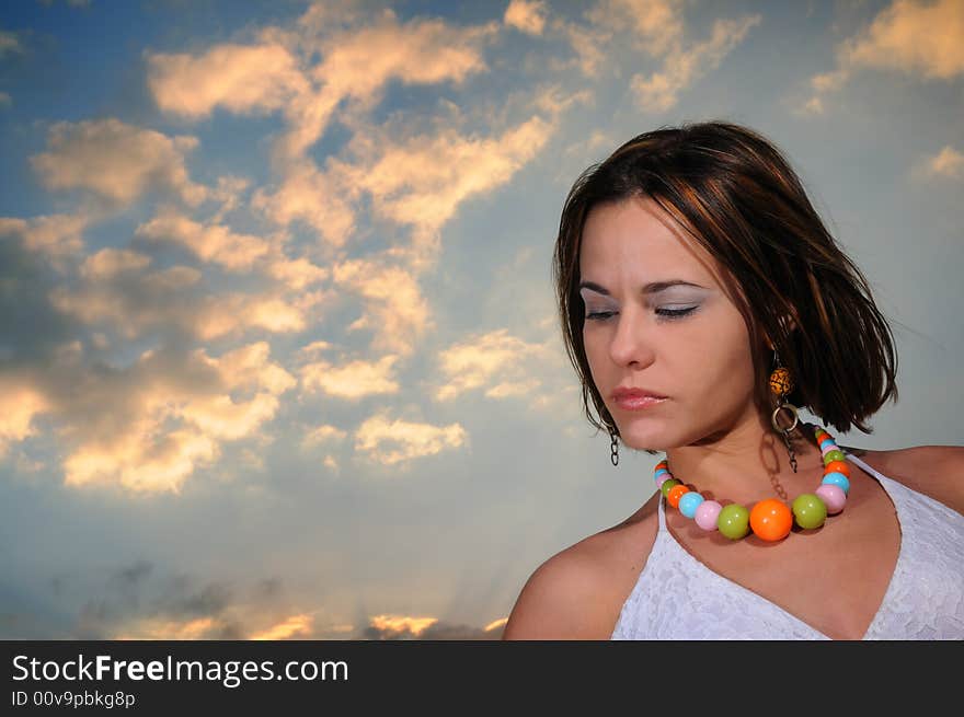 POrtrait of beautiful woman against sunset sky background. POrtrait of beautiful woman against sunset sky background