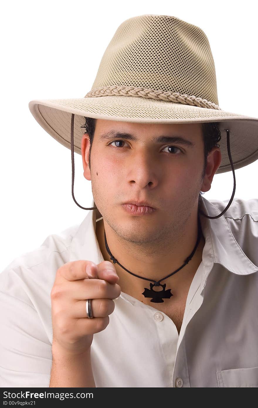 Young latin man with hat pointing