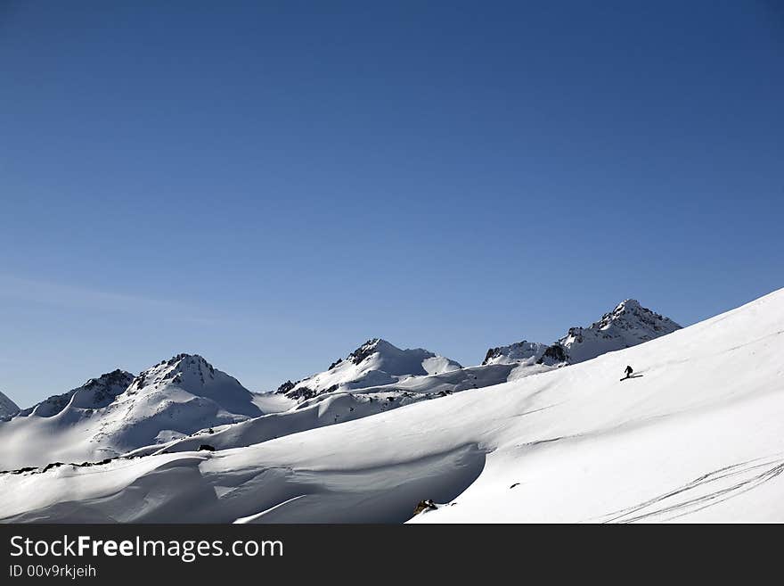 Ski freeride in high mountains, sky, winter