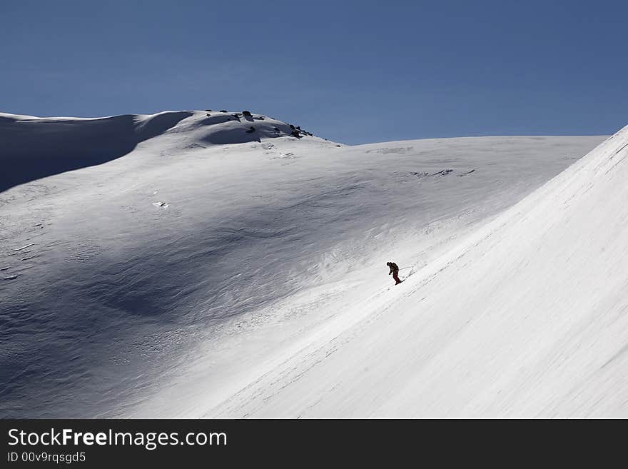 Ski freeride in high mountains, sky, winter