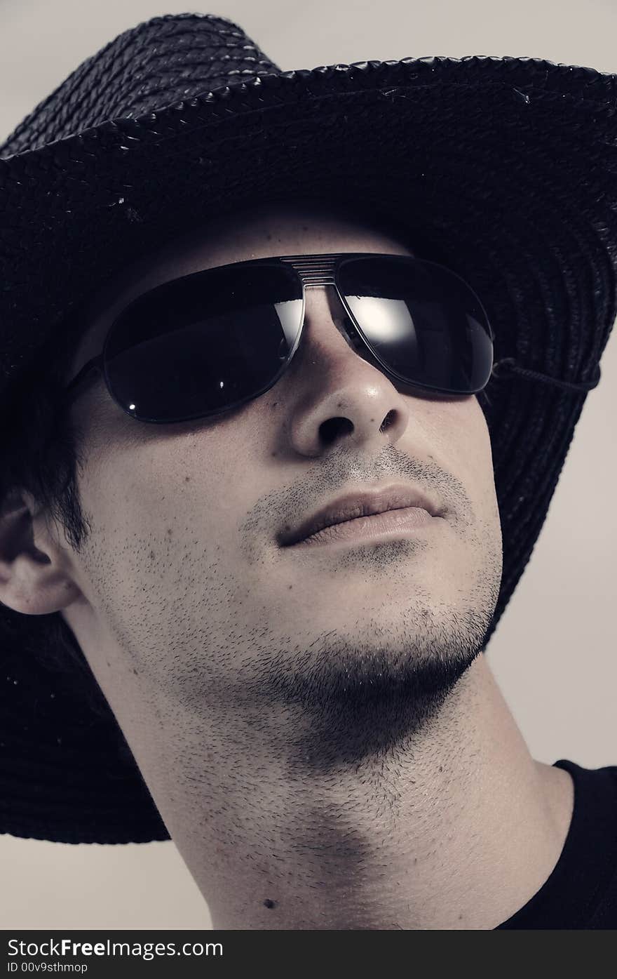 Portrait of young male wearing dark sunglasses. Portrait of young male wearing dark sunglasses