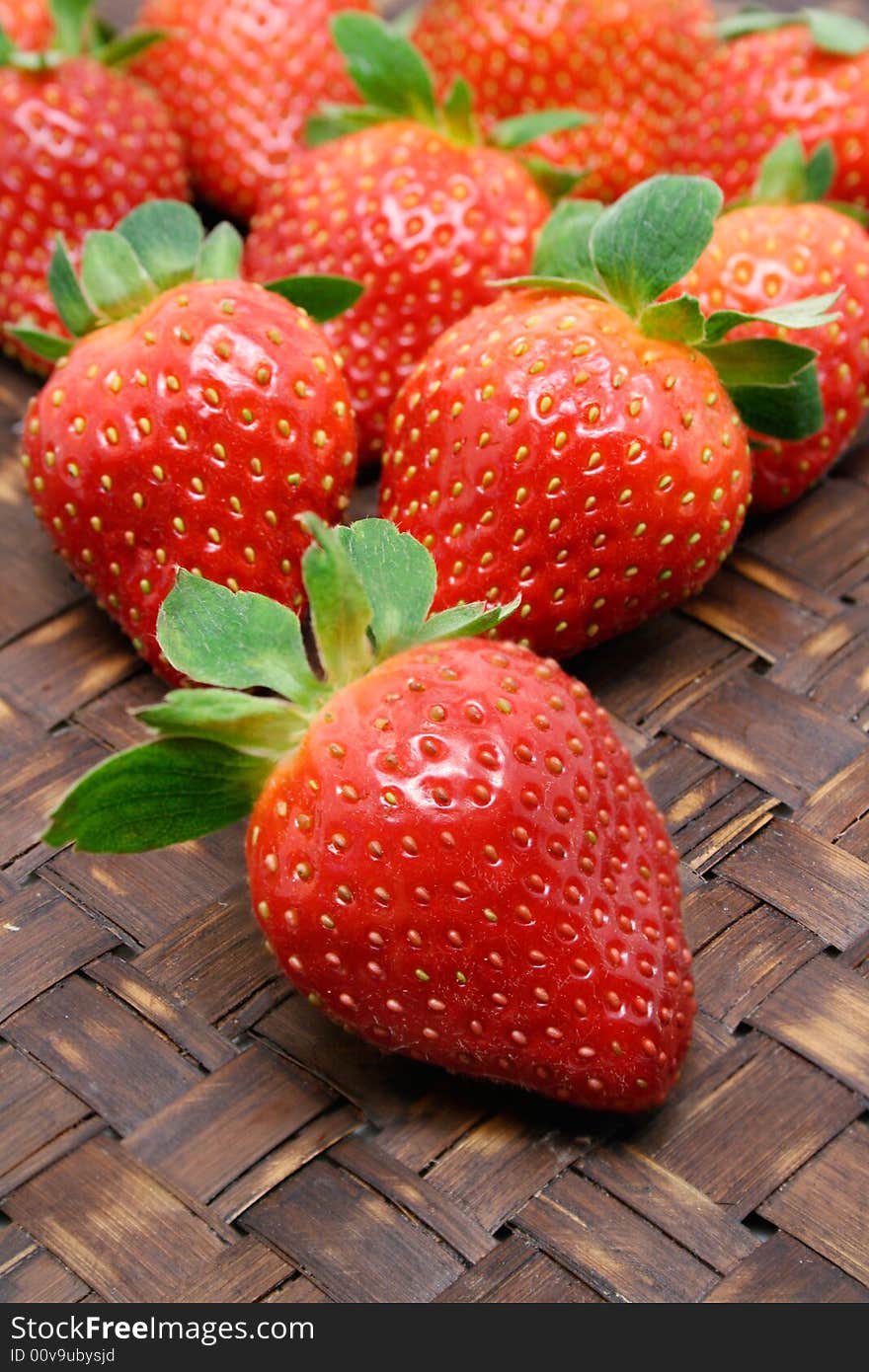 Fresh hand picked strawberries in a basket. Fresh hand picked strawberries in a basket