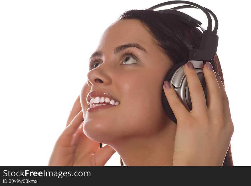 Girl listening to music isolated on white.