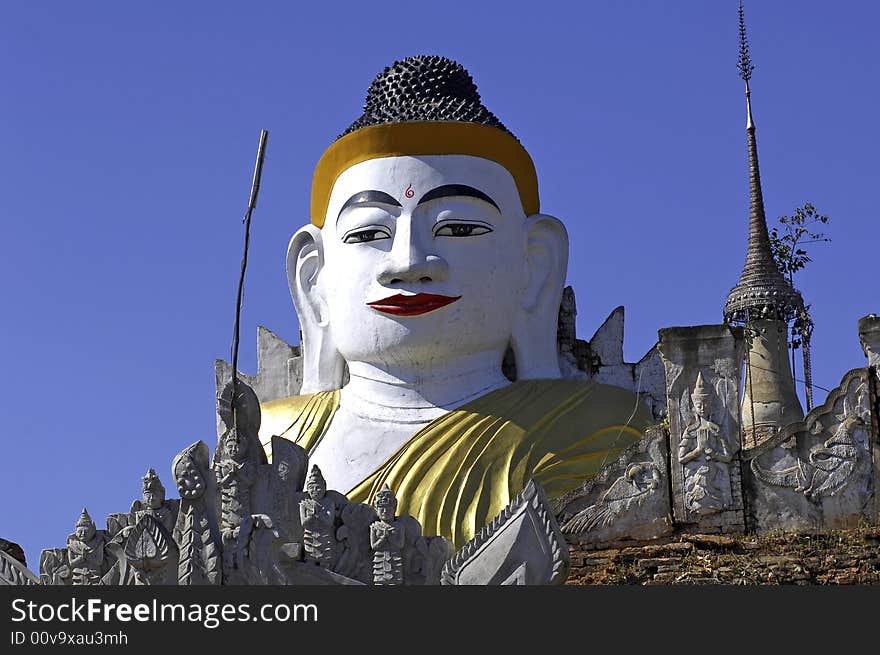 Myanmar, Inle Lake:  blue sky and buddha images at Nanthe Paya. Myanmar, Inle Lake:  blue sky and buddha images at Nanthe Paya