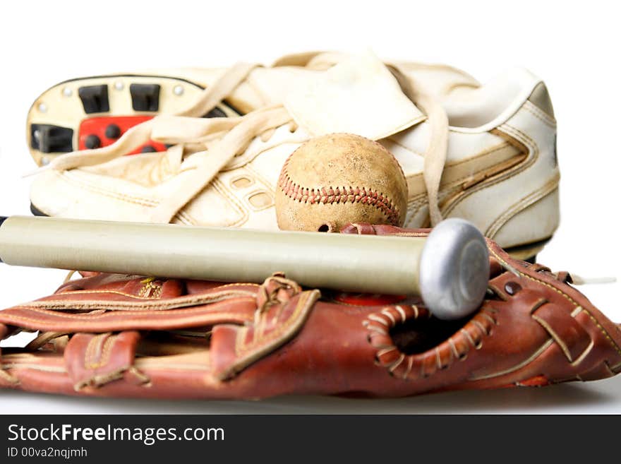 Baseball glove shoes and bat ready for the ball game. Baseball glove shoes and bat ready for the ball game