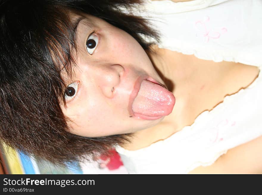 A chinese girl is grimacing. A chinese girl is grimacing.