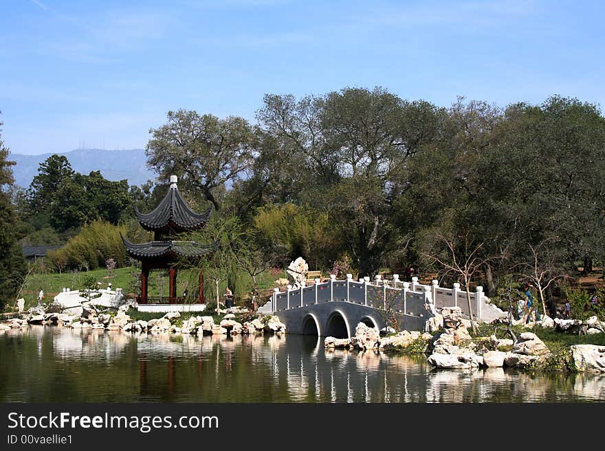 View of lake in Asian Garden with a pagoda in the background.