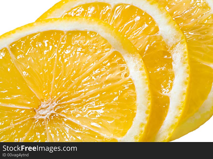 Slices of the cut lemon close up. Slices of the cut lemon close up