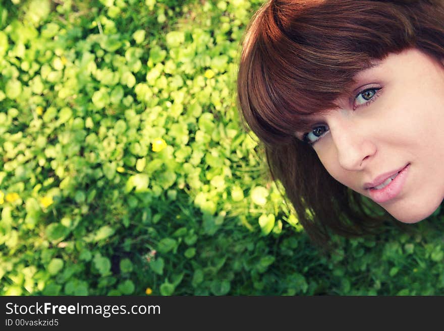 A beautiful girl on the grass